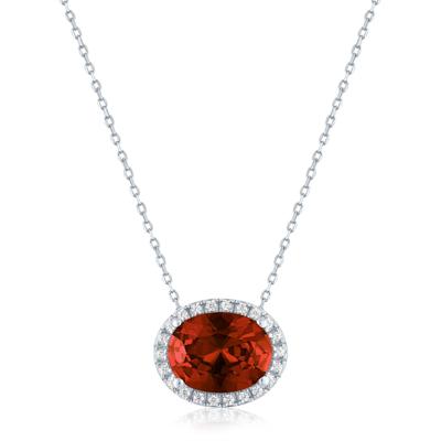 Garnet and Diamond Accent Halo Pendant in Sterling Silver
