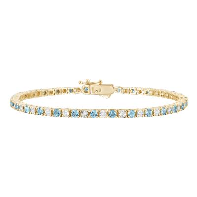 Blue Topaz & Diamond Line Bracelet in 10K Yellow Gold (1/7 ct. tw.)