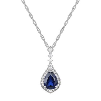 Lab Created Blue Sapphire Lab Created White Sapphire Halo Pendant in Sterling Silver