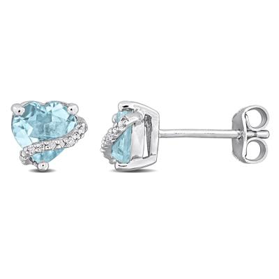 Blue Topaz and Diamond Accent Heart Studs in Sterling Silver