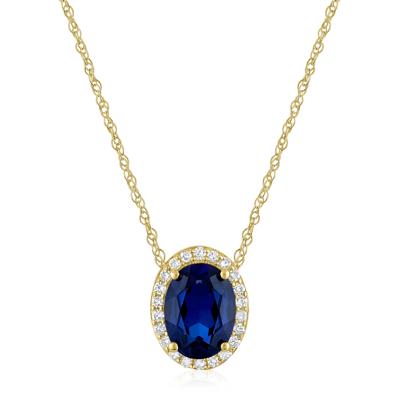 Oval Lab-Created Blue Sapphire and Diamond Accent Halo Pendant in 10K Yellow Gold