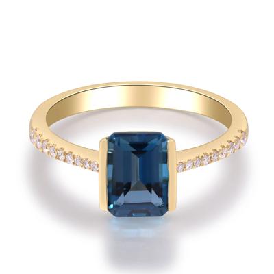 Blue Topaz Center & Diamond Ring in 10K Yellow Gold (1/10 ct. tw.)