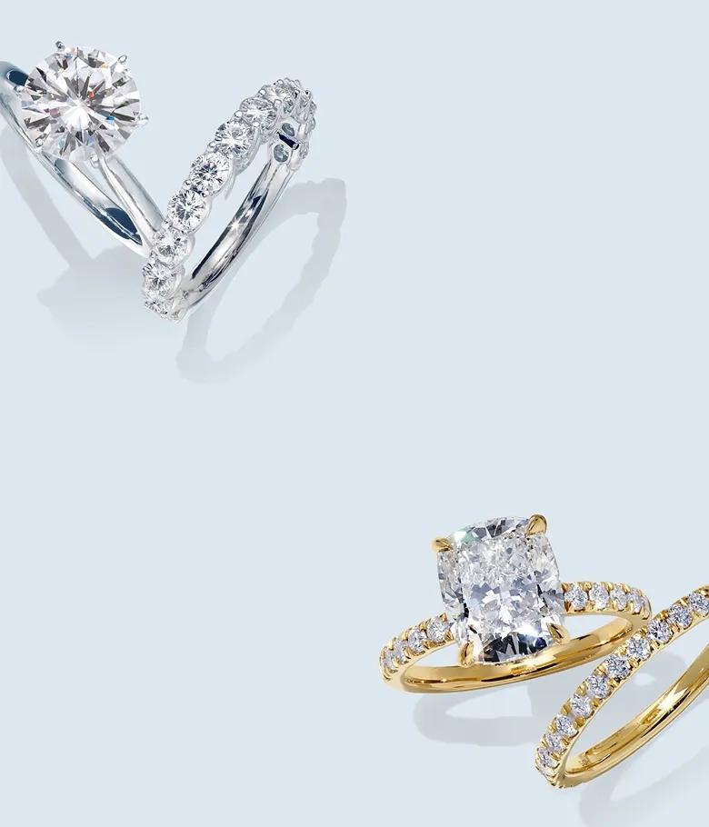 Image of two sets of engagement rings and wedding bands, one in white gold and one in yellow gold.